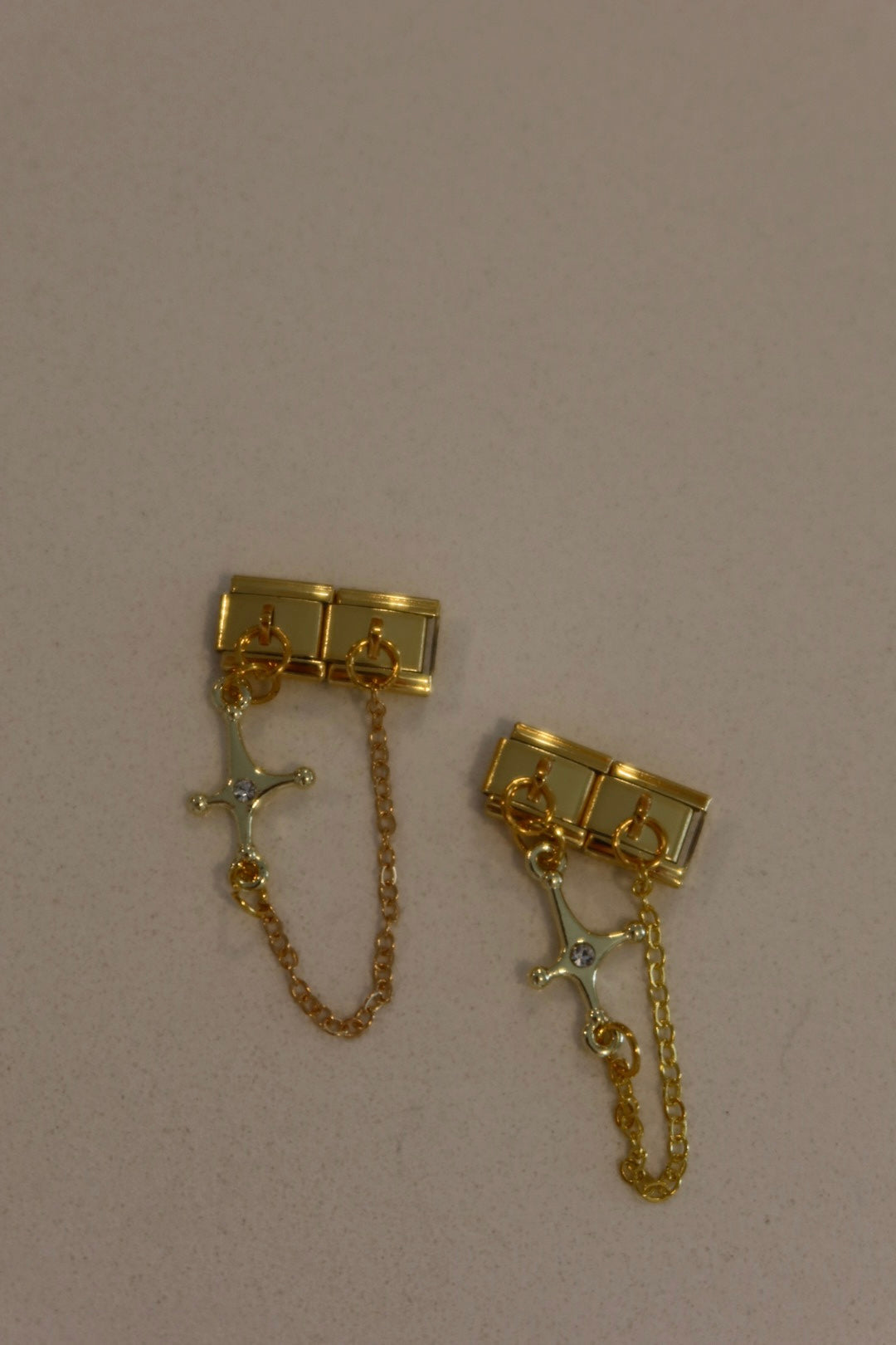 Golden cross charm